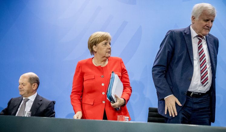 Scholz, Merkel und Seehofer